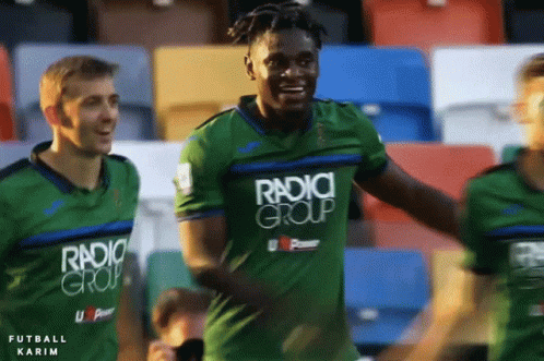 Soccer Player Celebrating in Green Jersey