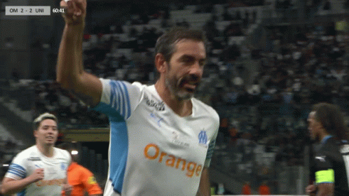 Soccer Player Celebrating in Orange Jersey