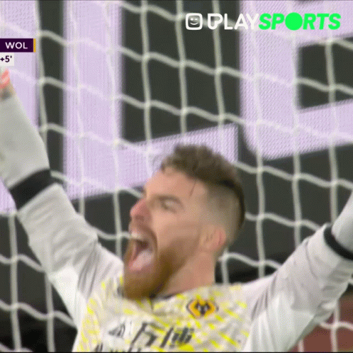 Soccer Player Celebrating with Arms Up