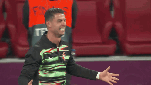 Soccer Player Covering Face Man in Suit Holding Shoulder