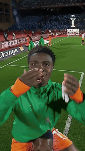 Soccer Player Covering Mouth At Caf Africa Ad GIF