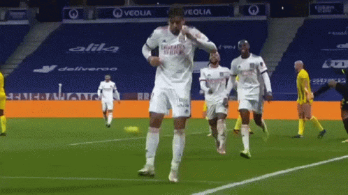 Soccer Player Dancing in Fly Emirates Shirt
