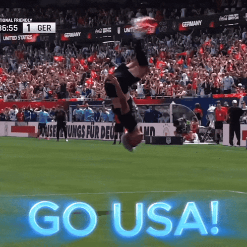 Soccer Player Doing Handstand on Field with Go USA