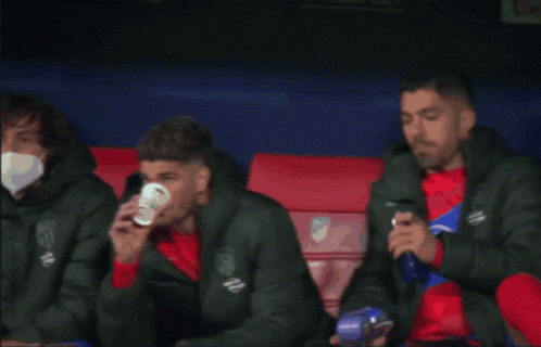Soccer Player Drinking Cup On Bench GIF
