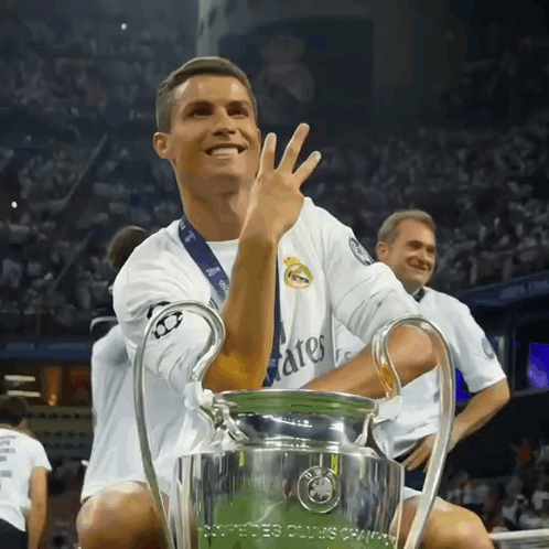 Soccer Player Holding Champions League Trophy