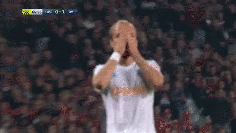 Soccer Player Holding Head In Hands