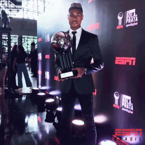 Soccer Player Holding Trophy And Box GIF