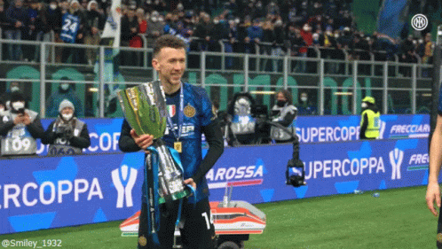 Soccer Player Holding Trophy Supercoppa Banner