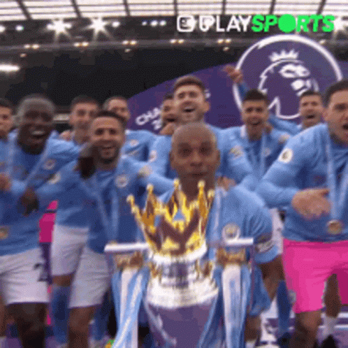 Soccer Player Holding Trophy