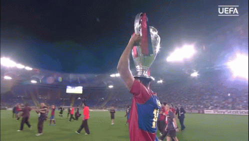 Soccer Player Holding UEFA Trophy