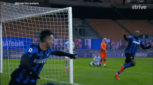 Soccer Player in 44 Jersey Hugging Another