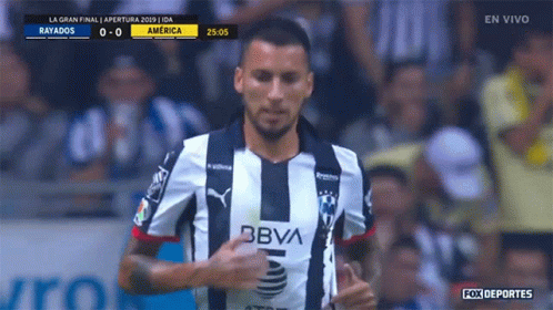 Soccer Player in BBVA Jersey Running