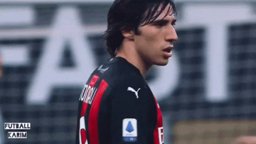 Soccer Player in Black and Red Puma Jersey