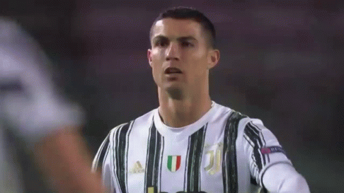 Soccer Player in Black and White Striped Jersey
