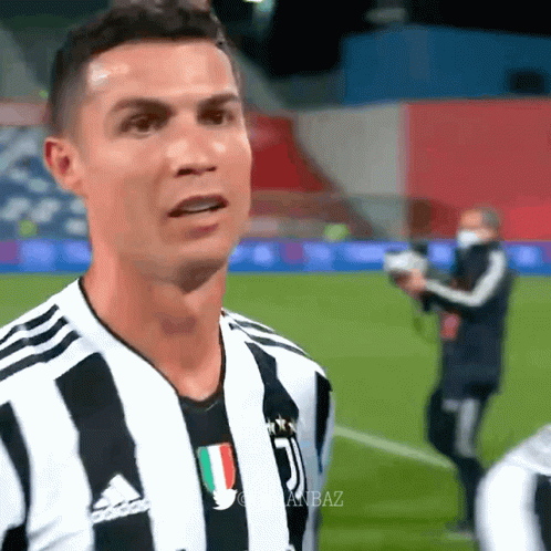 Soccer Player in Black and White Striped Jersey with Letter D