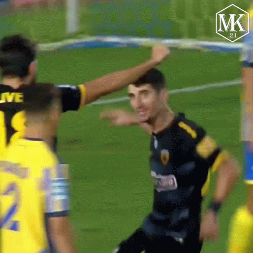 Soccer Player in Black and Yellow Jersey Number 8