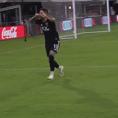 Soccer Player In Black Jersey With White Eagle Running GIF