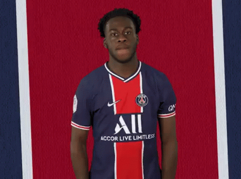 Soccer Player in Blue and Red Jersey High Five