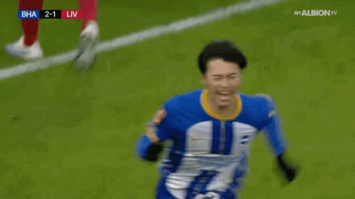 Soccer Player in Blue and White Jersey Celebrating Goal