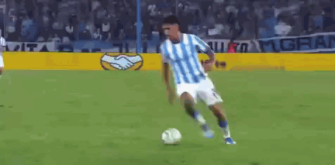 Soccer Player In Blue And White Jersey Kicking Ball GIF