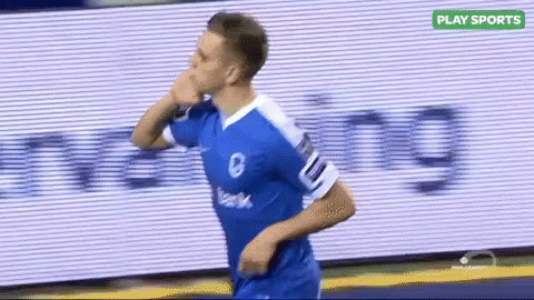 Soccer Player in Blue and White Jersey Running