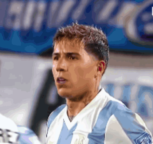 Soccer Player in Blue and White Jersey With Letter R