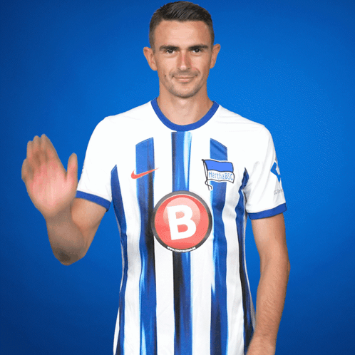 Soccer Player in Blue and White Striped Shirt With Letter B