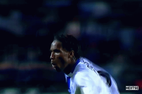 Soccer Player in Blue and White Uniform