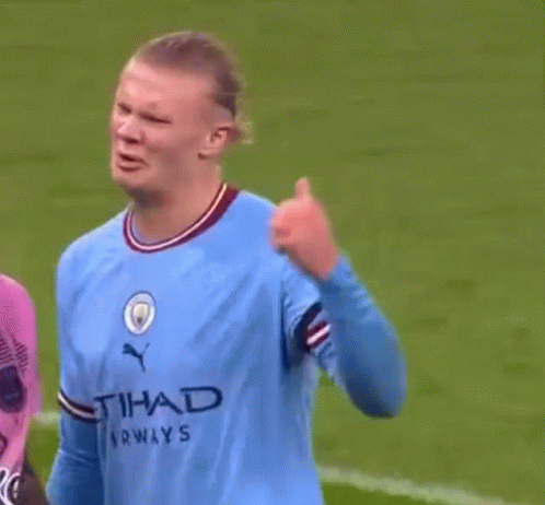 Soccer Player in Blue Etihad Shirt
