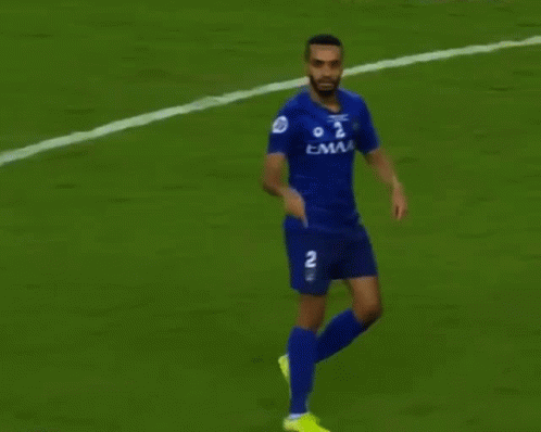 Soccer Player in Blue Jersey Number 2 Running
