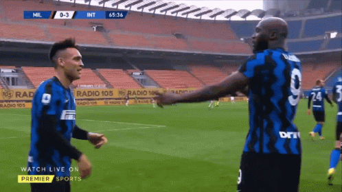 Soccer Player in Blue Jersey Number 9 Celebrating with Fans