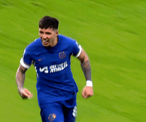 Soccer Player in Blue Jersey Saying Exchange