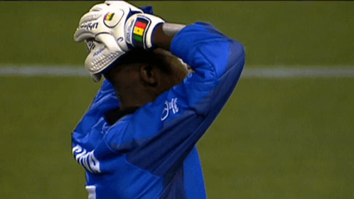 Soccer Player In Blue Jersey With JMC On Sleeve GIF