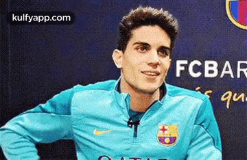 Soccer Player In Blue Nike Jacket Smiling GIF