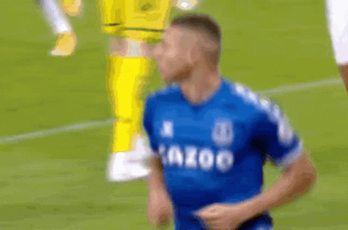 Soccer Player in Blue Shirt Running