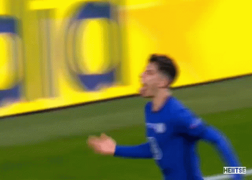 Soccer Player in Blue Shirt Running