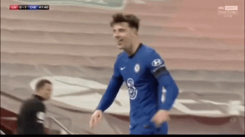 Soccer Player in Blue Shirt With H on Sleeve