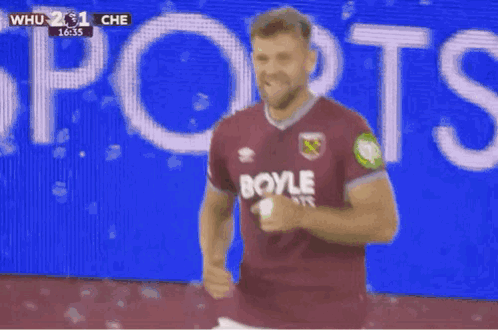 Soccer Player In Burgundy Shirt Celebrating Goal GIF