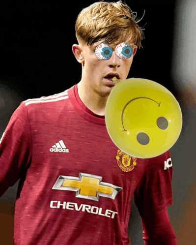 Soccer Player in Chevrolet Jersey Holding Smiley