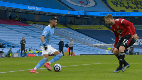 Soccer Player in City Jersey Kicking Ball