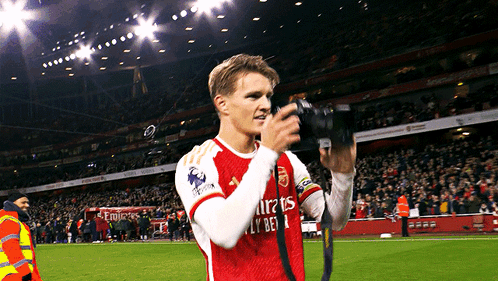 Soccer Player In Emirates Fly Bet Jersey Taking Picture GIF
