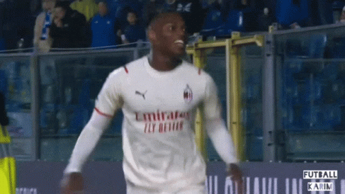 Soccer Player in Emirates Fly Better Jersey Celebrates