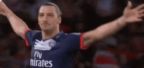 Soccer Player In Fly Emirates Jersey Arms Outstretched GIF