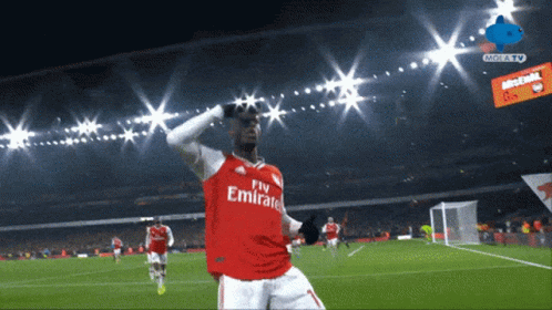 Soccer Player in Fly Emirates Jersey Celebrating Goal