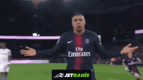 Soccer Player in Fly Emirates Jersey Celebrating Goal