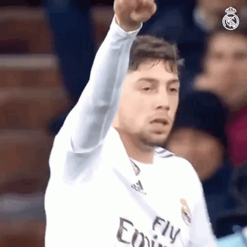 Soccer Player in Fly Emirates Jersey Fists Up