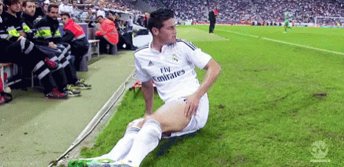 Soccer Player In Fly Emirates Jersey On Field