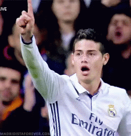 Soccer Player In Fly Emirates Jersey Raises Fist GIF