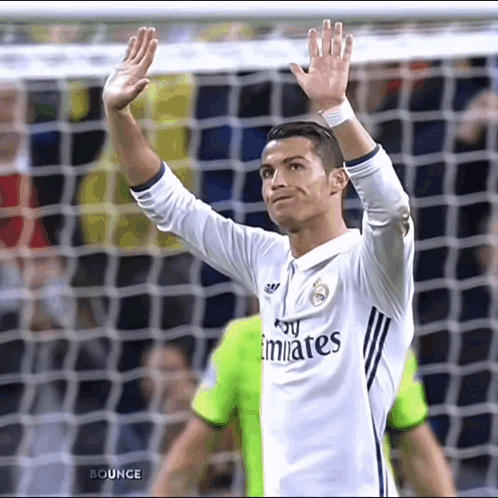 Soccer Player in Fly Emirates Shirt Waving Hand