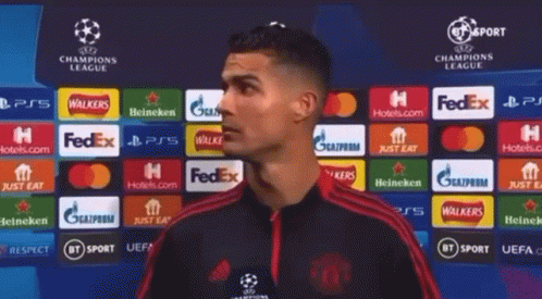 Soccer Player in Front of Champions League Banner